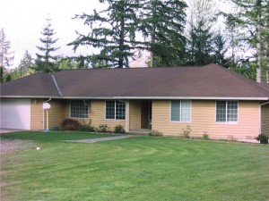 Eastern exposure for morning sunlight. This rambler sits on .93 acres and the large front yard has a circular driveway for easy access and plenty of room for all your gardening ideas.